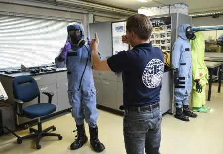 Photo showing inspectors from the global chemical arms watchdog, La Hague, Netherland. (AFP)