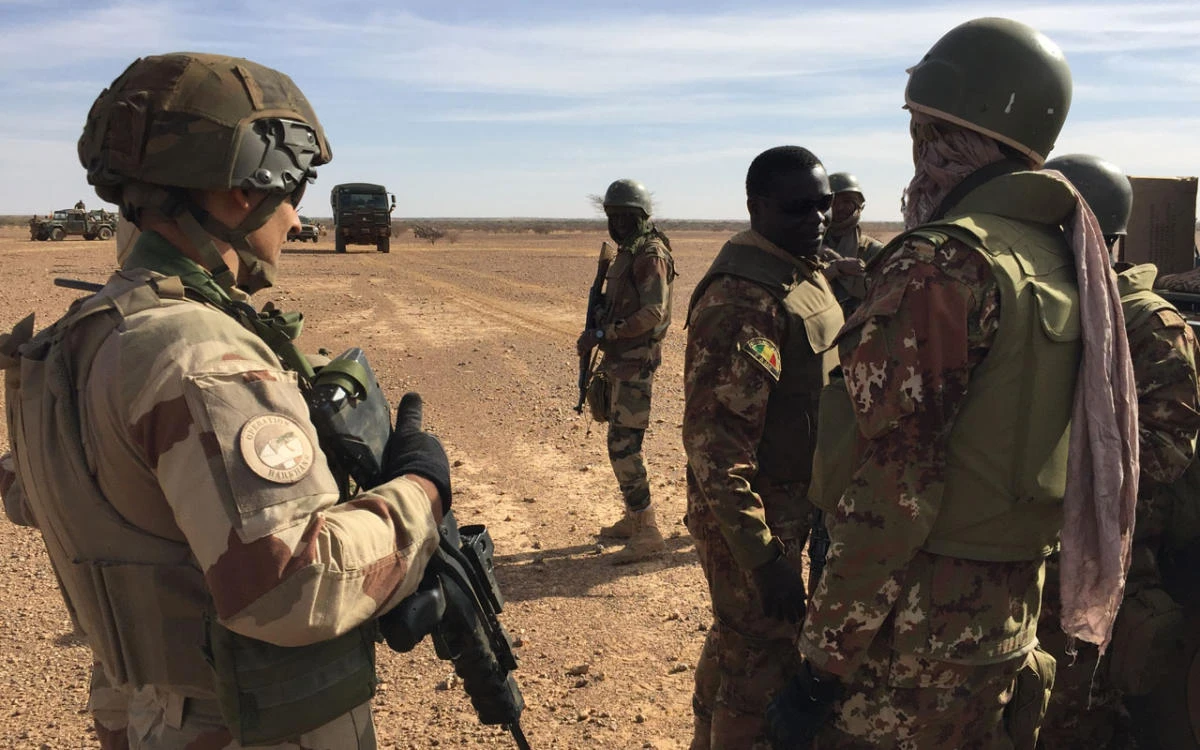 In this file photo, Malian soldiers taking part in a tactical coordination operation with soldiers of France’s Operation Barkhane mission patrol. (AFP)