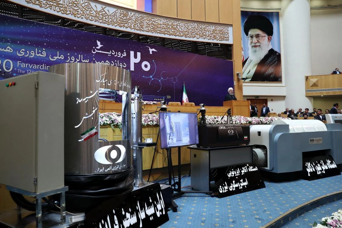 A handout picture provided by the office of Iranian President Hassan Rouhani on April 9, 2018 shows him (R) speaking during a ceremony to mark National Nuclear Technology Day in Tehran. (AFP PHOTO / HO / IRANIAN PRESIDENCY)