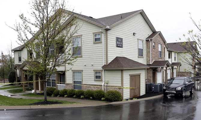 Police tape marks the apartment building reported to be where Travis Reinking lives in Nashville, Tennessee on April 22, 2018. Police say Reinking is the suspect in a shooting at a Waffle House restaurant Sunday in Nashville that left four people dead. (AP Photo/Mark Humphrey)
