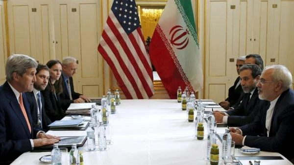 A file photo of the former US Secretary of State John Kerry and Iranian Foreign Minister Javad Zarif meeting in Vienna on Implementation Day of the nuclear deal. (Reuters)