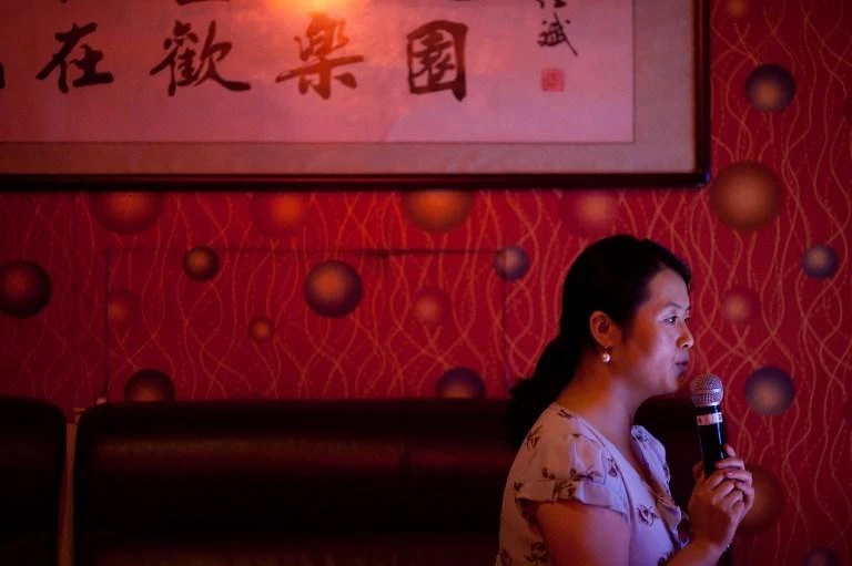 Karaoke is a popular activity in China, with even shopping centers featuring booths where people can sit and sing their favorite songs. (AFP)