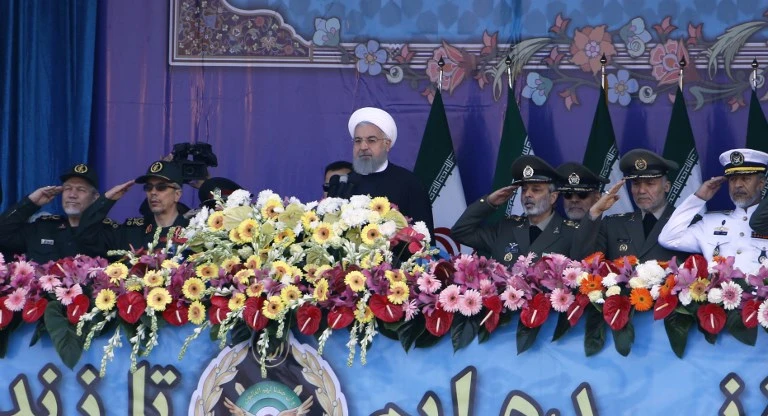 Iranian President Hassan Rouhani (C) and senior members of his armed forces watch a parade on the occasion of the country's annual army day on April 18, 2018, in Tehran. (AFP)