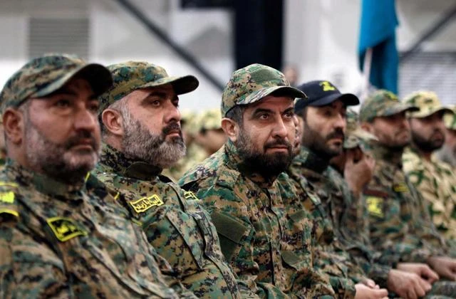 Hezbollah fighters listen to Hezbollah leader Sheik Hassan Nasrallah, via video link, in Beirut, Lebanon. Hezbollah operative Bilal Hassan was killed when a grenade cartridge he was holding exploded in his home. (AP Photo)