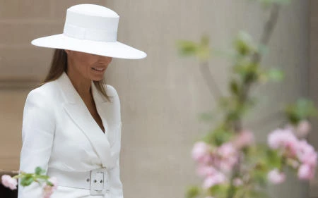 First lady Melania Trump greets the Macrons with a hat