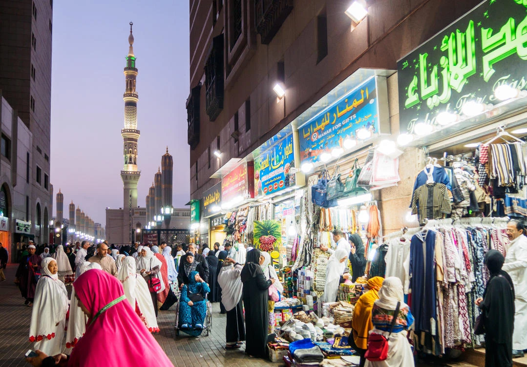 MEDINA, SAUDI ARABIA - 12 MARCH 2017 : Muslim pilgrims shopping at street bazaar near Nabawi Mosque