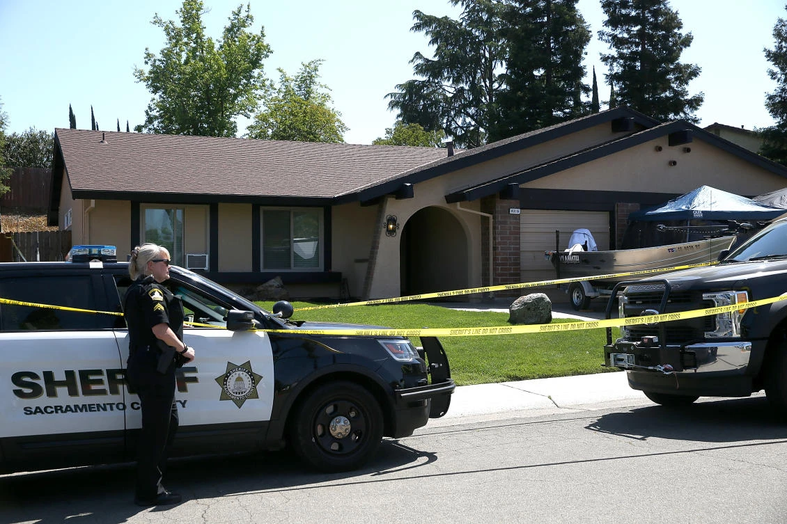 A Sacramento County sheriff deputy stands guard in front of the home of accused rapist and killer Joseph James DeAngelo on April 24, 2018 in Citrus Heights, California. (Justin Sullivan/Getty Images/AFP )