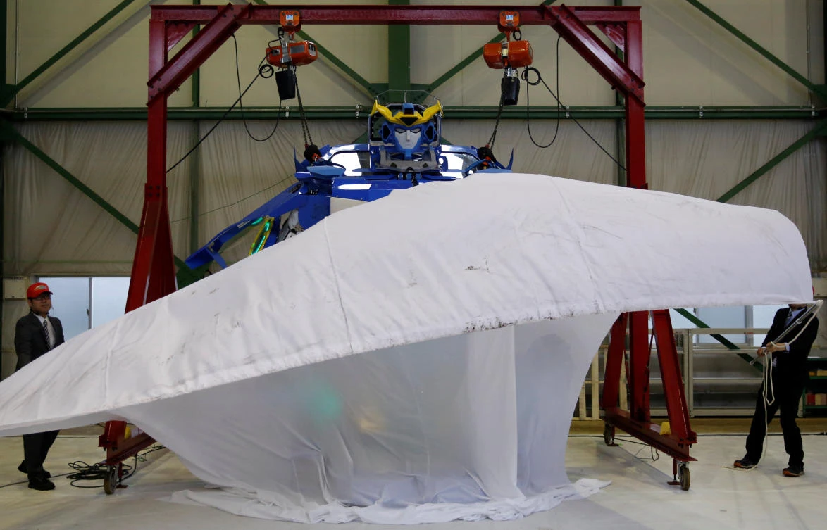 A new transforming robot called ‘J-deite RIDE’ that transforms itself into a passenger vehicle, is unveiled at a factory near Tokyo, Japan. (Reuters)
