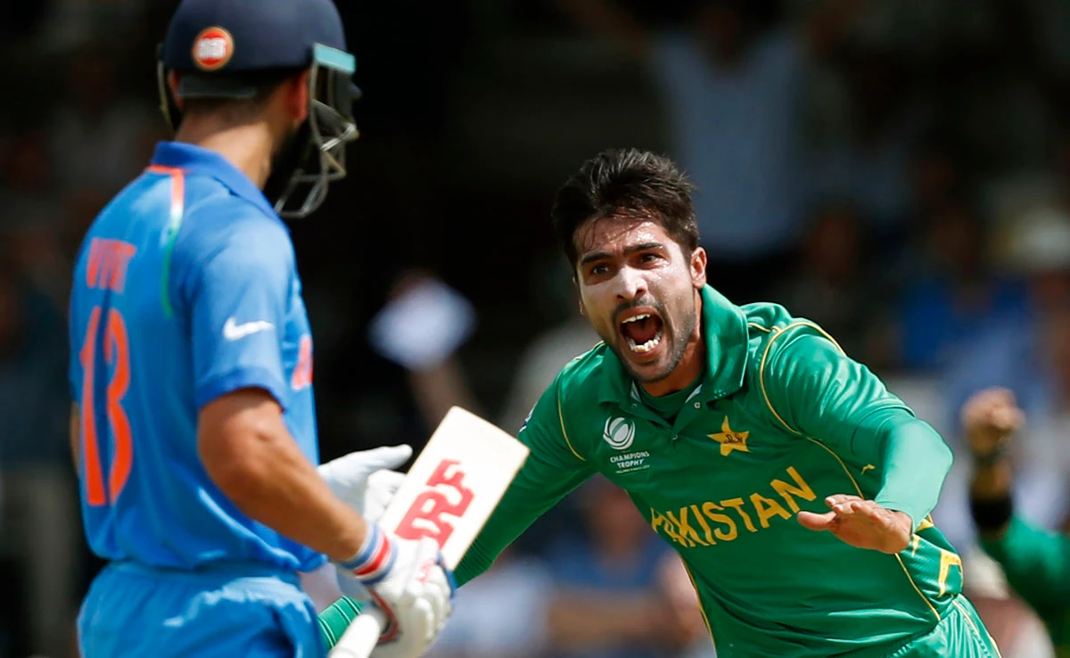 Pakistan’s Mohammad Amir celebrates after taking the wicket of India’s captain Virat Kohli - he will be hoping for more of the same when the two teams meet next summer.