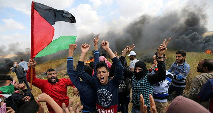 File photo showing Palestinian protesters demonstrating at Gaza border with Israel. (Reuters)