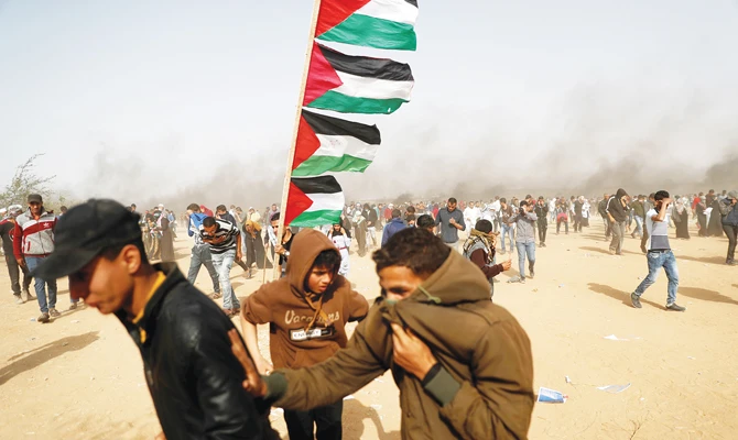 Each Friday, thousands of people have gathered in five tent camps near the border, while smaller groups throw stones and burn tires closer to the border fence. (AFP)