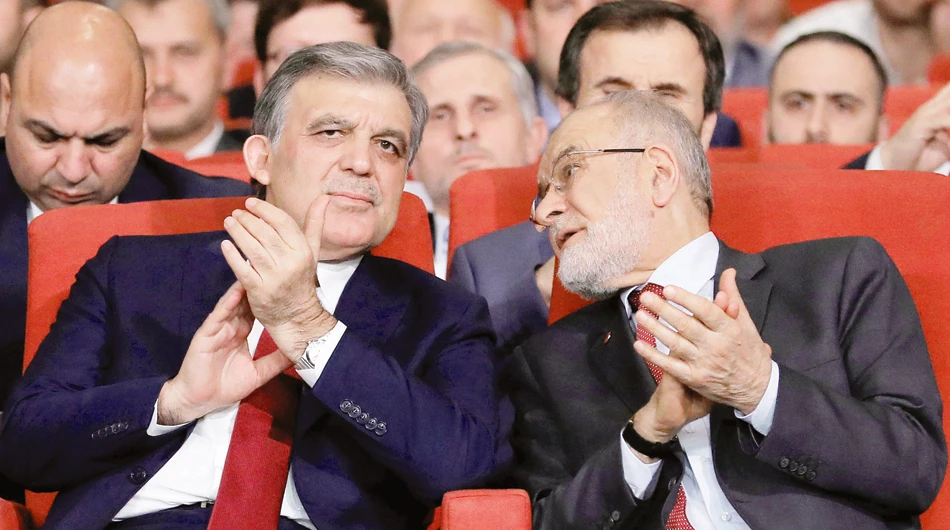Former Turkish President Abdullah Gul, left, is seen with Saadet Party leader Temel Karamollaoglu during a ceremony in Istanbul on Tuesday. (Reuters)