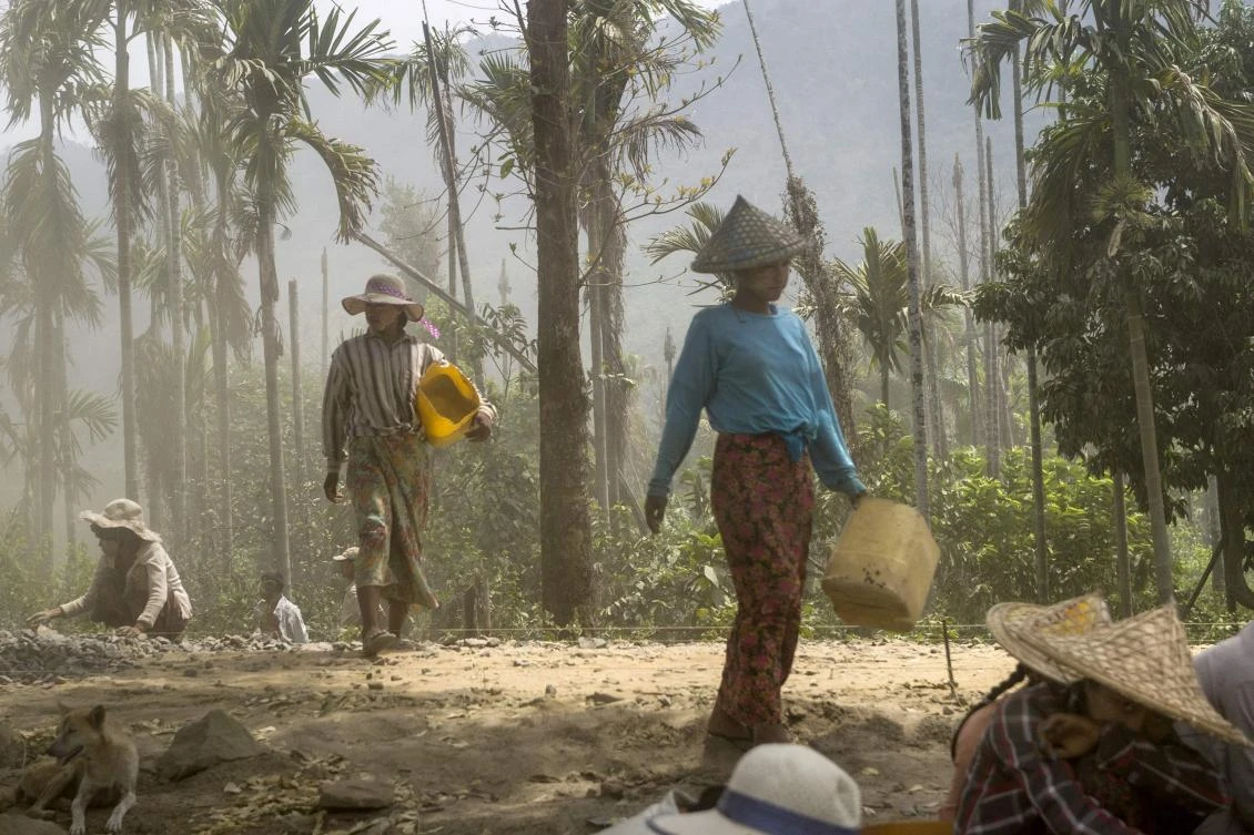 Laborers work on major road construction project in Maungdaw district, Myanmar’s Rakhine state near the Bangladesh border. (AFP)