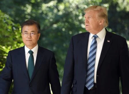 File photo showing South Korean President Moon Jae-in, US President Donald Trump arrive to give a joint press conference in the Rose Garden at the White House in Washington, DC, June 2017. (AFP)