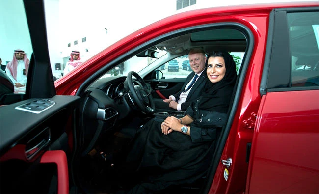 Aseel Alhamad and Chris Grayling at the Mohamed Yousuf Naghi Motors showroom in Jeddah.