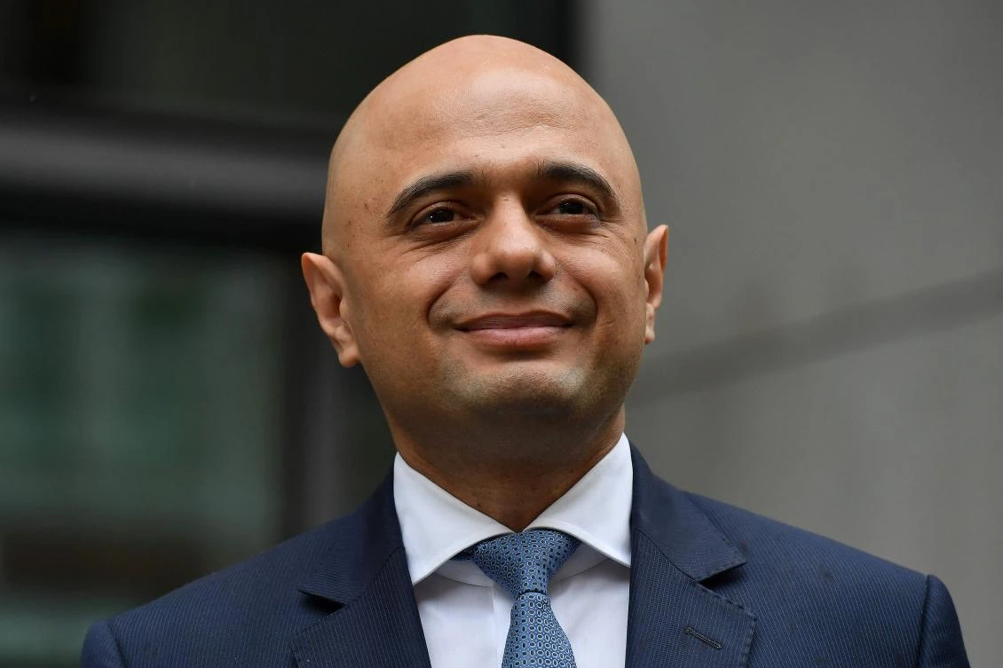 Britain’s newly appointed Home Secretary Sajid Javid poses for a photograph after exiting the Home Office in central London on April 30, 2018. (AFP/Ben Stansall)