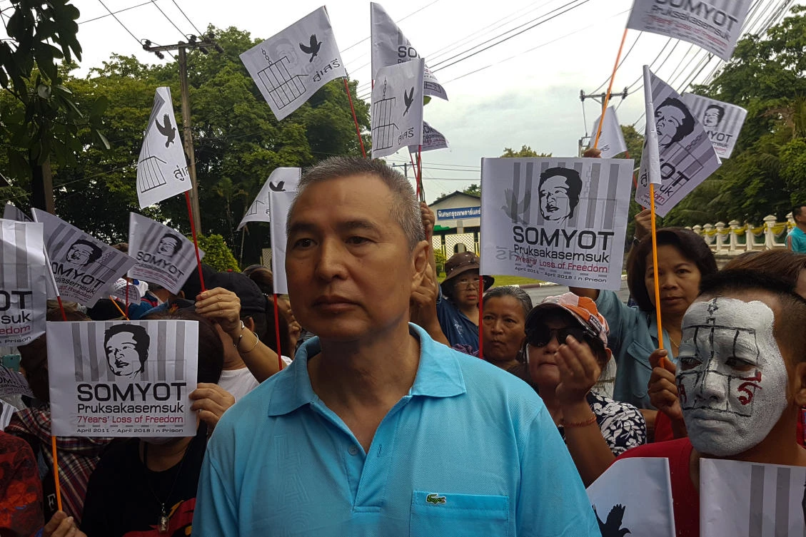 Somyot Prueksakasemsuk, 56, a high-profile Thai activist and former magazine editor jailed for insulting the country's monarchy, stands next to his supporters after his release from a Bangkok prison in Thailand, April 30, 2018. (Reuters)