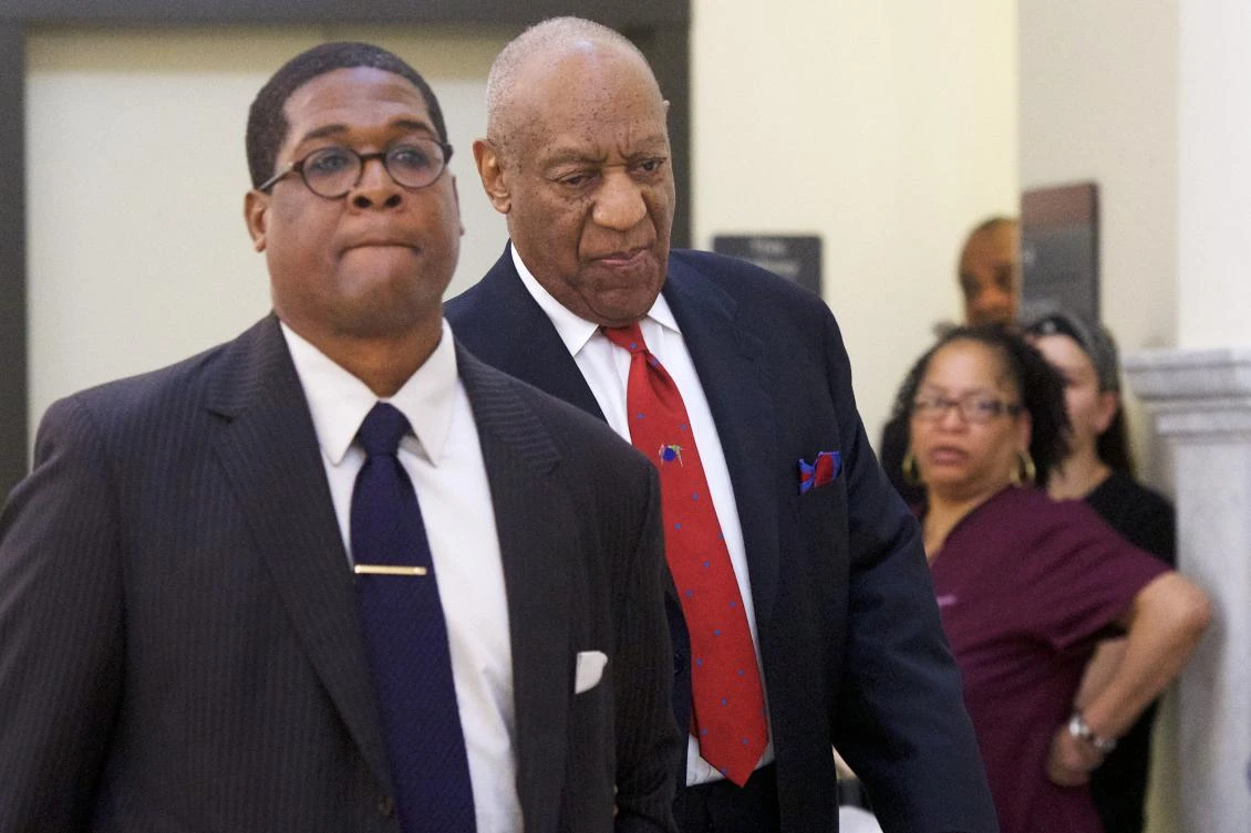 In this file photo taken on April 26, 2018 Bill Cosby (C) walks through the Montgomery County Courthouse with his publicist, Andrew Wyatt, after being found guilty on all counts in his sexual assault retrial in Norristown, Pennsylvania. (Mark Makela /Getty Images North America / AFP)