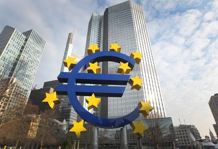 This file photo taken on February 7, 2018 shows German artist Ottmar Hoerl's sculpture depicting the Euro logo is pictured in front of the former headquarter of the European Central Bank (ECB) in Frankfurt. (AFP)