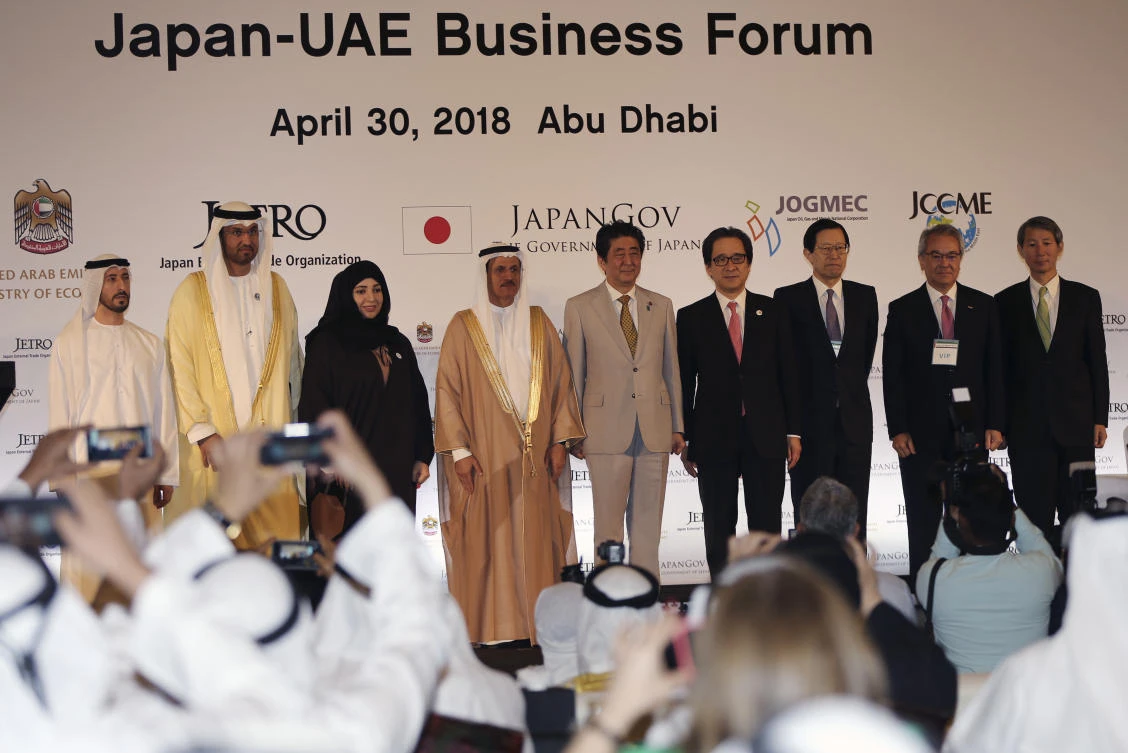 UAE Minister of State and a member of the UAE Federal Cabinet, Dr. Sultan Al-Jaber, 3rd left, UAE minister of Economy, Sultan Al Mansoori, 4th left, and Japanese Prime Minister Shinzo Abe with the others pose for a picture during the Japan-UAE Business Forum in Abu Dhabi, United Arab Emirates.(AP)