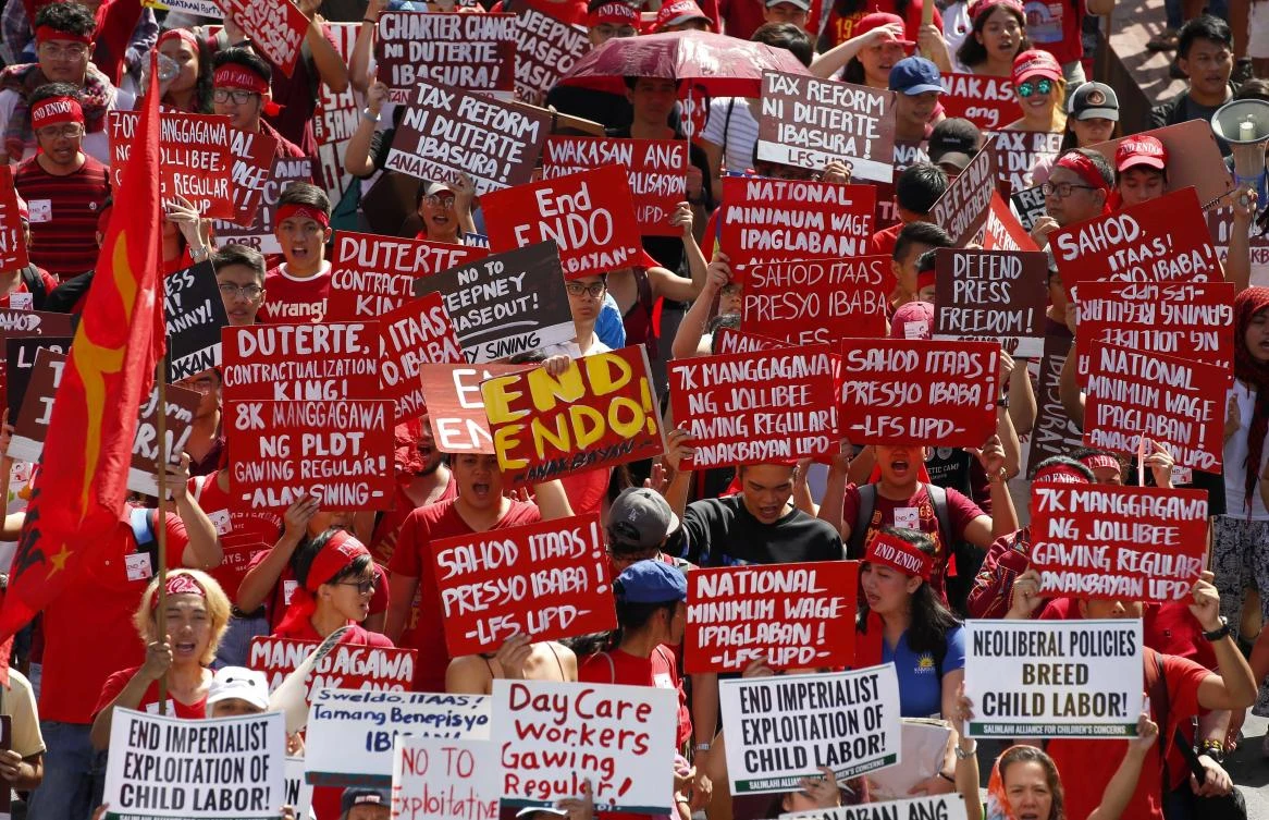 Protesters, mostly workers, march toward the Presidential Palace during the global commemoration of Labor Day Tuesday, May 1, 2018 in Manila, Philippines. (AP/Bullit Marquez)