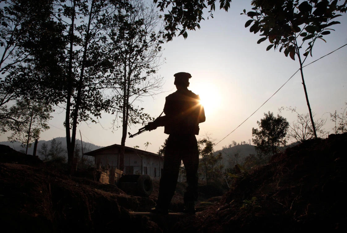 In this March 20, 2018 photo, a Kachin Independence army rebel stands at frontline outpost facing no man’s land in Lawa Yang, outside of Laiza, the armed group’s headquarters in northern Kachin state, Myanmar. (AP)