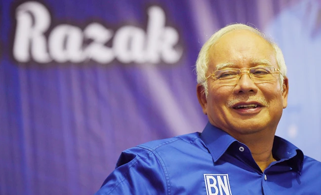 Malaysian Prime Minister Najib Razak of the ruling coalition party Barisan Nasional gestures during a campaign event ahead of the upcoming 14th general elections, in Kuala Lumpur on May 1, 2018. (AFP)