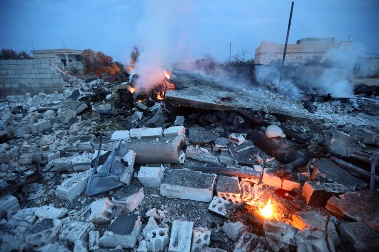 A picture taken on February 3, 2018, shows smoke billowing from the site of a downed Sukhoi-25 fighter jet in Syria's northwest province of Idlib. (AFP)