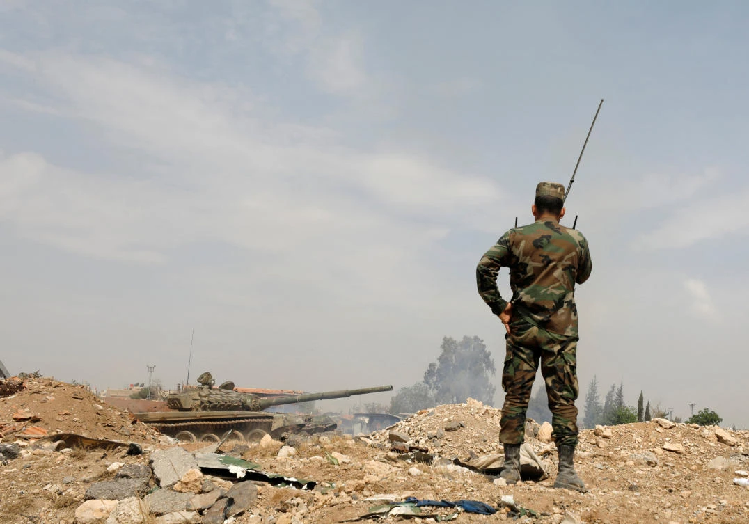 Soldiers loyal to Syria’s President Bashar Assad forces are deployed at Al-Qadam area near Yarmouk Palestinian camp in Damascus. Assad has focused on dislodging rebels from their remaining besieged pockets since driving them from eastern Ghouta last month after a fierce offensive. (Reuters)