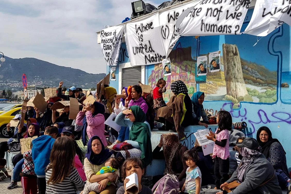 File photo showing migrants on Lesbos Island where residents and businesses went on strike for lack of refugees dispersal policy. (AFP)