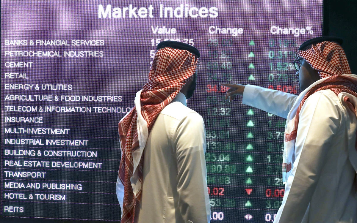 Inside The Saudi Stock Exchange As Saudi Stocks GainVisitors stand and watch stock movements displayed on large video screens inside the Saudi Stock Exchange, also known as the Tadawul All Share Index in Riyadh, Saudi Arabia, on Monday, Nov.28, 2016. The Tadawul All Share Index advanced 26 percent since Saudi Arabias record-breaking bond sale last month, the most in the world during that period. Photographer: Simon Dawson/Bloomberg via Getty Images