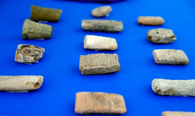 Ancient cuneiform tablets from Iraq that are being returned by Immigration and Customs Enforcement (ICE) are seen during a ceremony at the residence of the Iraqi Ambassador in Washington, US, on May 2, 2018. (AP Photo/Jacquelyn Martin)