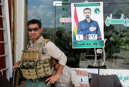 File Photo showing a security officer standing guard outside a Kurdish candidate's office for the parliamentary elections in Iraq. (Reuters)