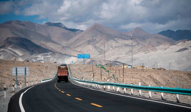 The file photo shows a truck is driving along the China-Pakistan Friendship Highway before the Karakorum mountain range near Tashkurgan in China's western Xinjiang province. (AFP)