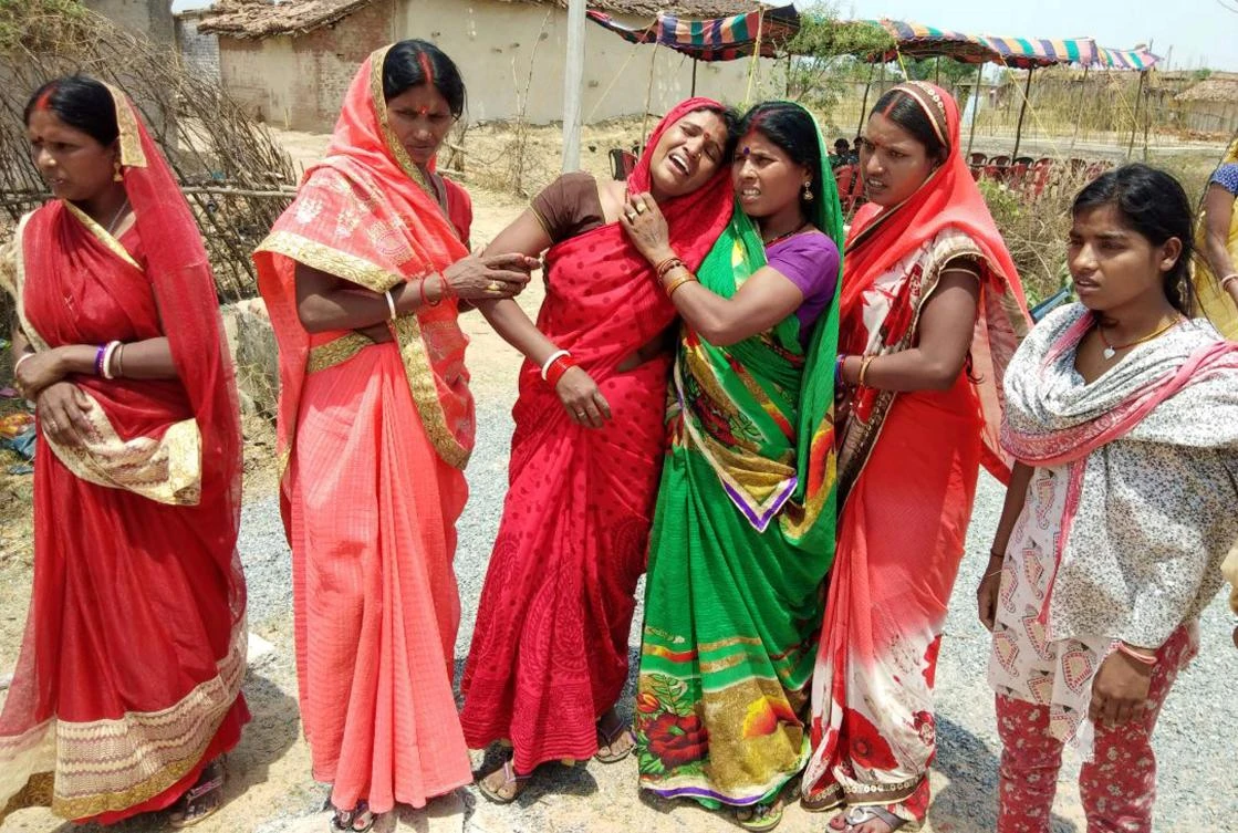 In this photograph taken on May 5, 2018, Indian relatives mourn following the rape and murder of a 16-year-old girl on May 3, at Raja Kundra Village in Chatra district of the eastern Indian state of Jharkhand. (AFP)