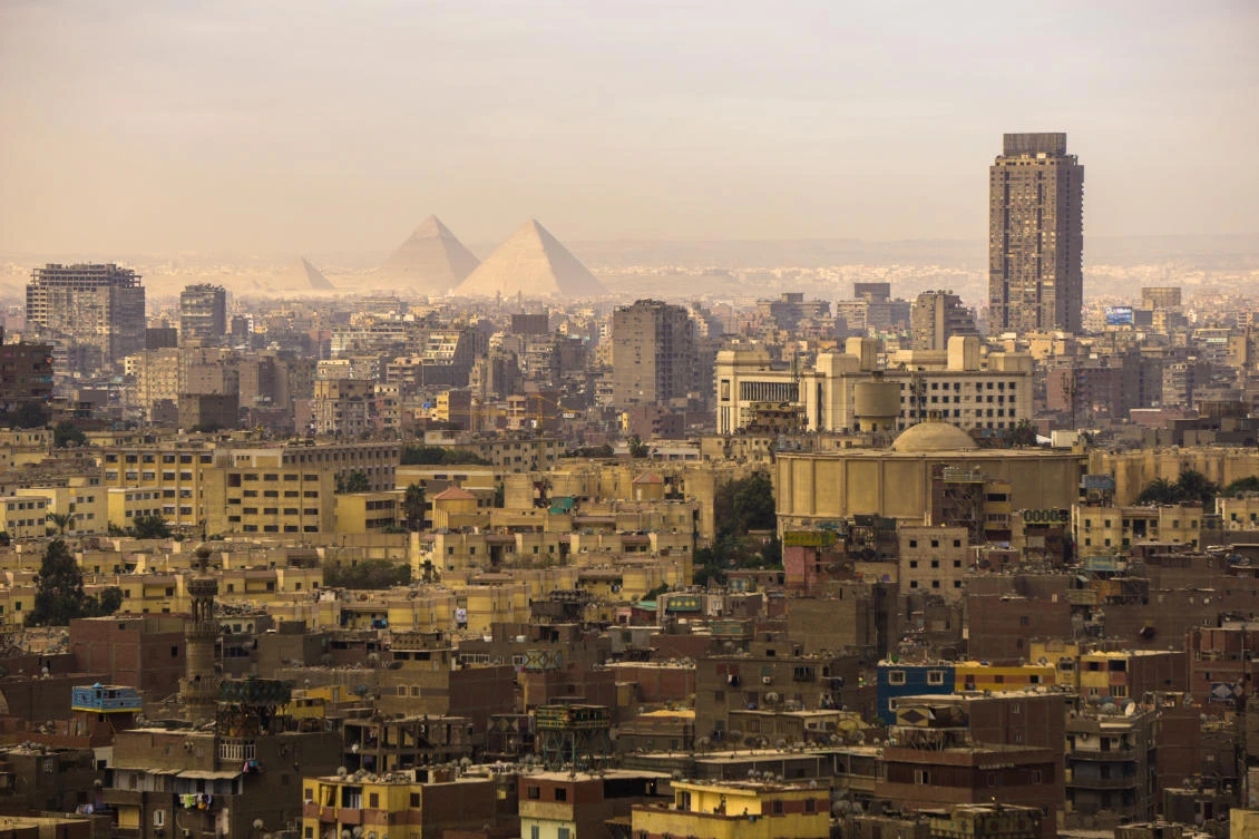 Cairo city with the pyramids in the background (Shutterstock)