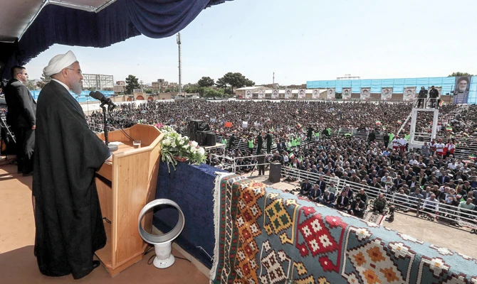 Addressing Iranians in the northwestern city of Sabzevar, President Hassan Rouhani warned the US against withdrawing from the nuclear deal. (AFP)