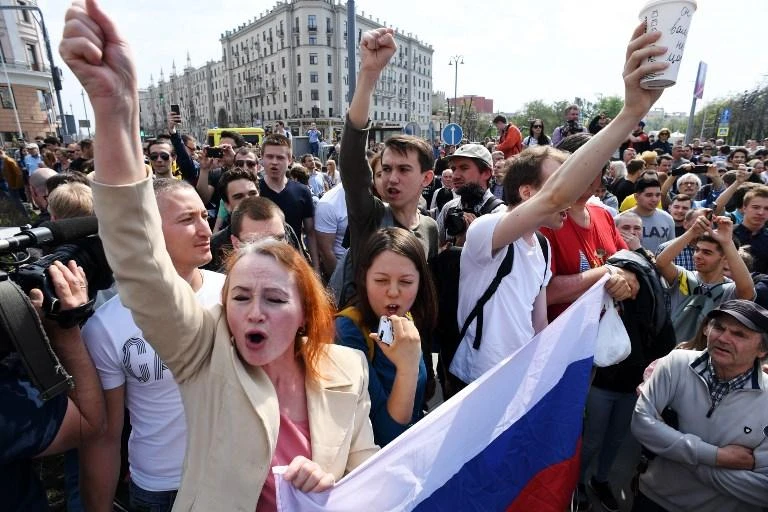 Opposition supporters shout slogans during an anti-Putin rally called by opposition leader Alexei Navalny on May 5 in Moscow, two days ahead of Vladimir Putin's inauguration for a fourth Kremlin term. (AFP)