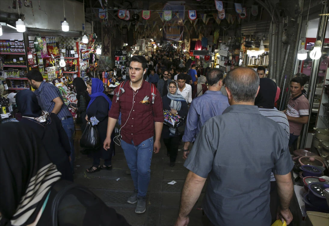 Iranians walk through Tehran’s old main bazaar, Iran, Sunday, May 6, 2018. From airplanes to oilfields, billions of dollars are on the line for international corporations as President Donald Trump weighs whether to pull America out of Iran’s nuclear deal with world powers. For Western businesses, the deal meant access to Iran’s largely untapped market of 80 million people. (AP/Vahid Salemi)