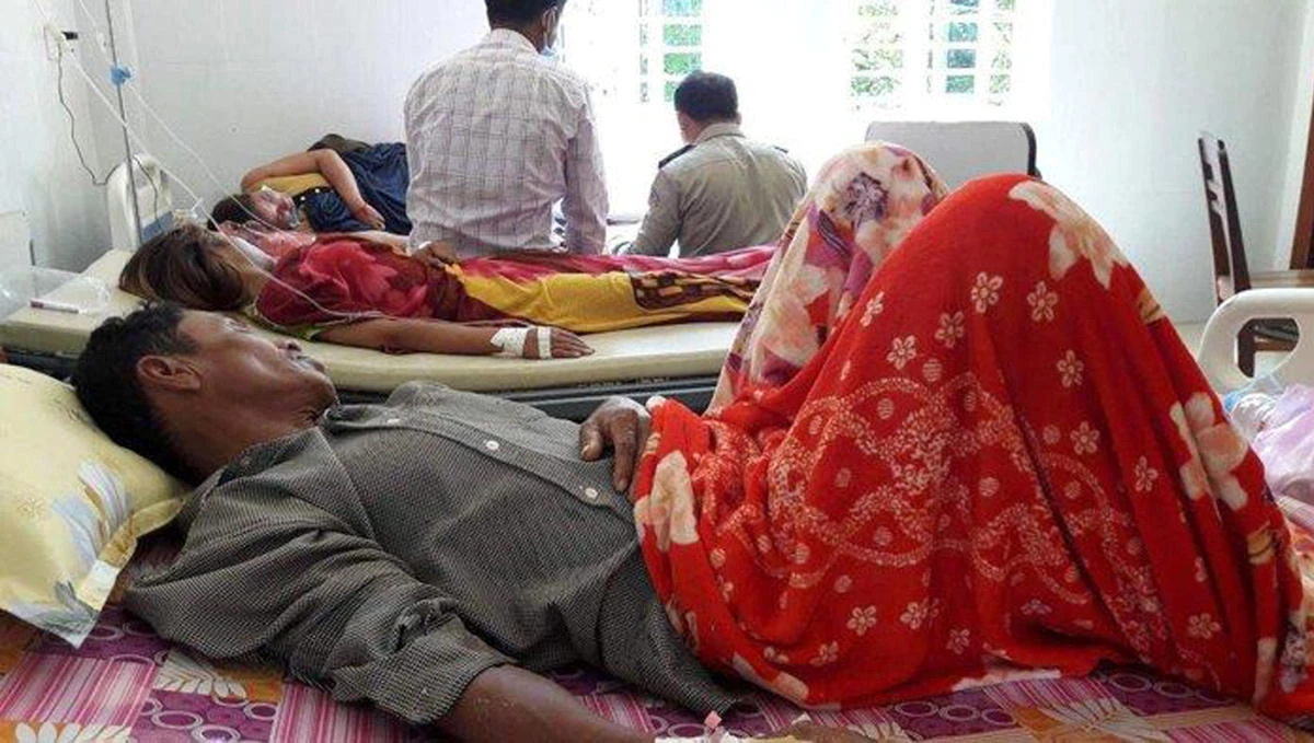A senior Cambodian health official said Monday, May 7, 2018, 14 villagers whose sudden deaths were thought to have been caused by polluted water actually died from drinking rice wine containing methanol. (Cambodia National Police via AP)