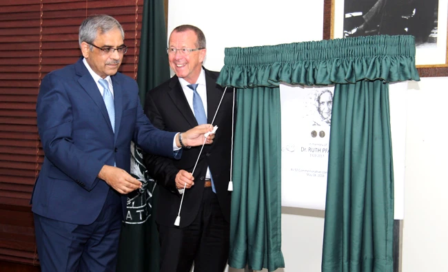 State Bank of Pakistan's Governor Tariq Bajwa and German Ambassador Martin Kobler unveil 50-rupee commemorative coin in recognition of meritorious services rendered by Dr. Ruth Katherina Martha Pfau during an event in Karachi. (Photo courtesy: State Bank of Pakistan)