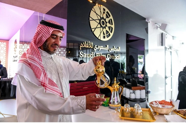 Photo showing Saudi Film Council wing at Cannes film festival, a participant offers Arabic coffee a traditional drink in the Kingdom. (AN Photo/Ammar Abd Rabbo)