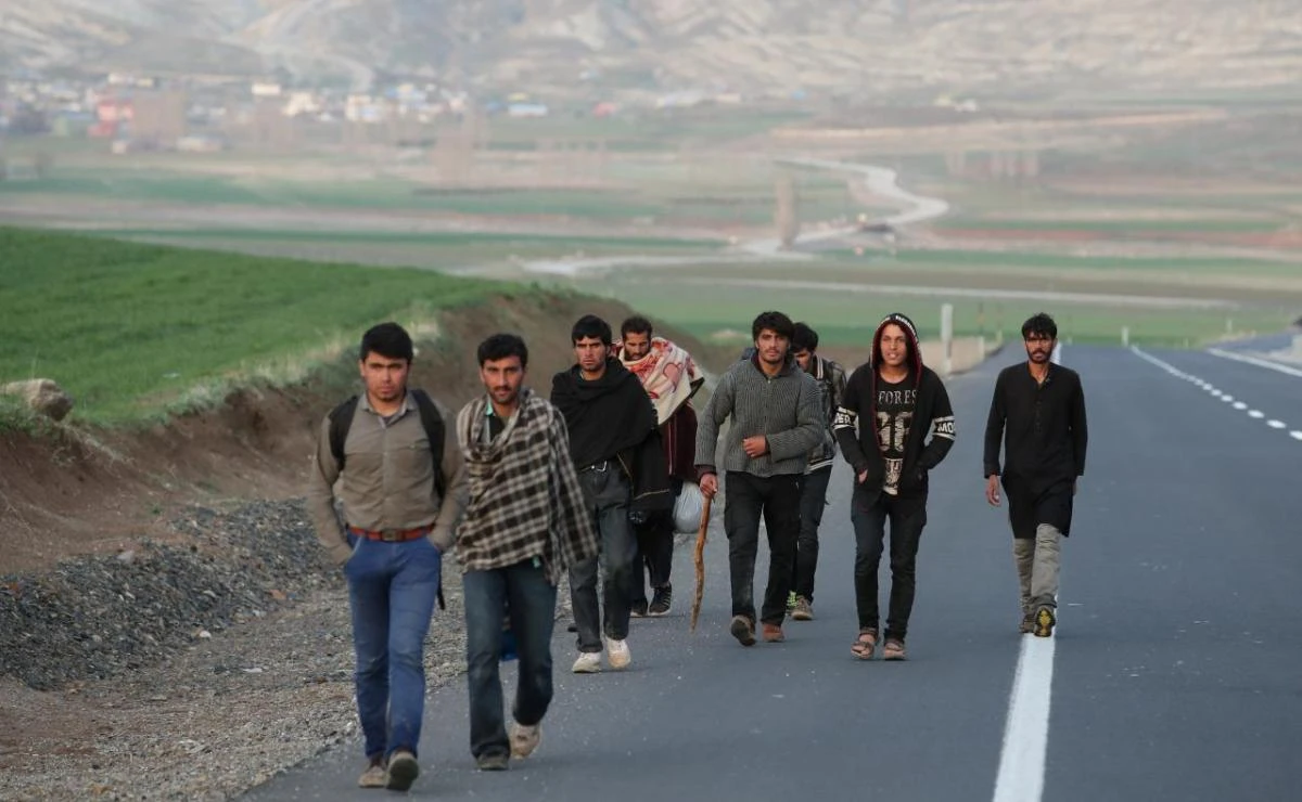 Afghan migrants walk along a road after crossing the Turkey-Iran border near Dogubayazit in Agri province. Almost 18,000 Afghans arrived in Turkey between January and March this year. (Reuters)