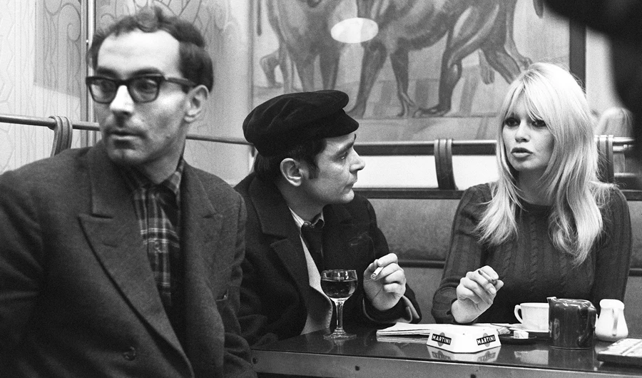 Brigitte Bardot, right, and Jean-Luc Godard, left, on the set of Godard’s ‘Masculin-Feminin’ in 1965. (AFP)