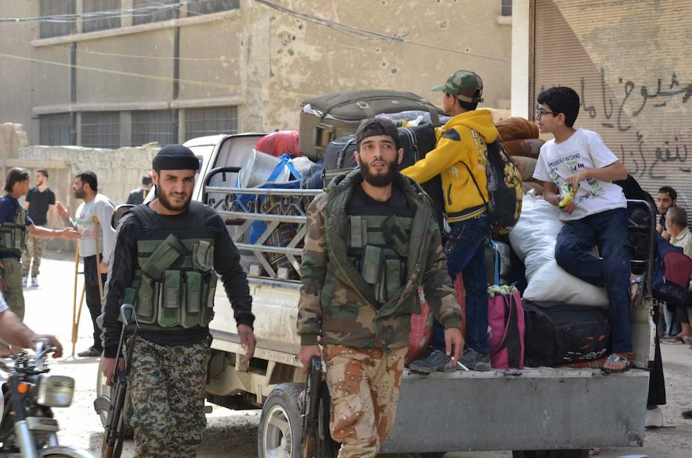 Syria rebels exit towns near Damascus, leaving only Daesh