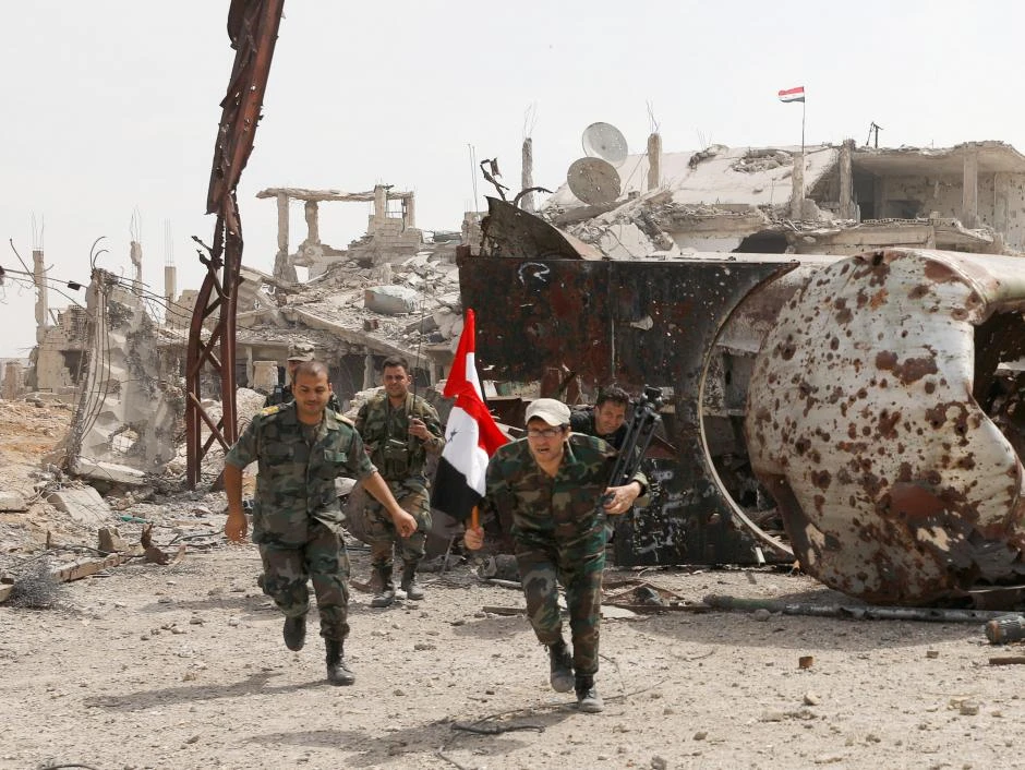 File photo showing soldiers loyal to Syria’s President Bashar Assad forces at Al-Qadam area near Damascus, Syria. (Reuters)