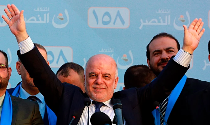 In this May 1, 2018 file photo, Iraq Prime Minister Haider al-Abadi, speaks during a campaign rally in Baghdad, Iraq. (AP Photo/Hadi Mizban, File)