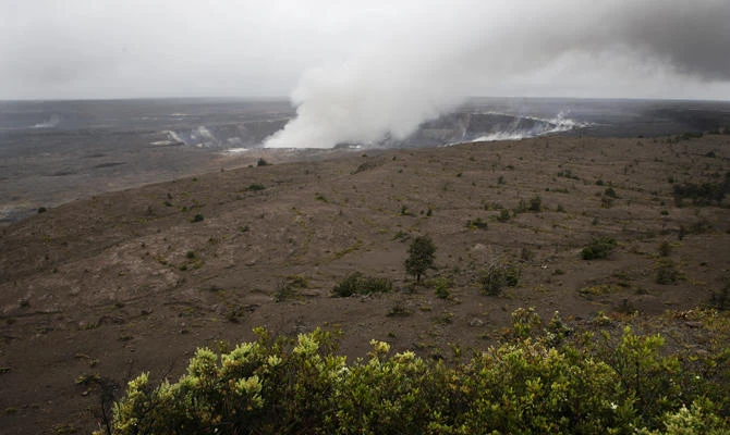 Steam and gas rise from Kilauea's summit crater in Volcanoes National Park, Hawaii, on May 10, 2018. The park is closing Friday due to the threat of an explosive volcanic eruption. (AP Photo/Jae C. Hong)