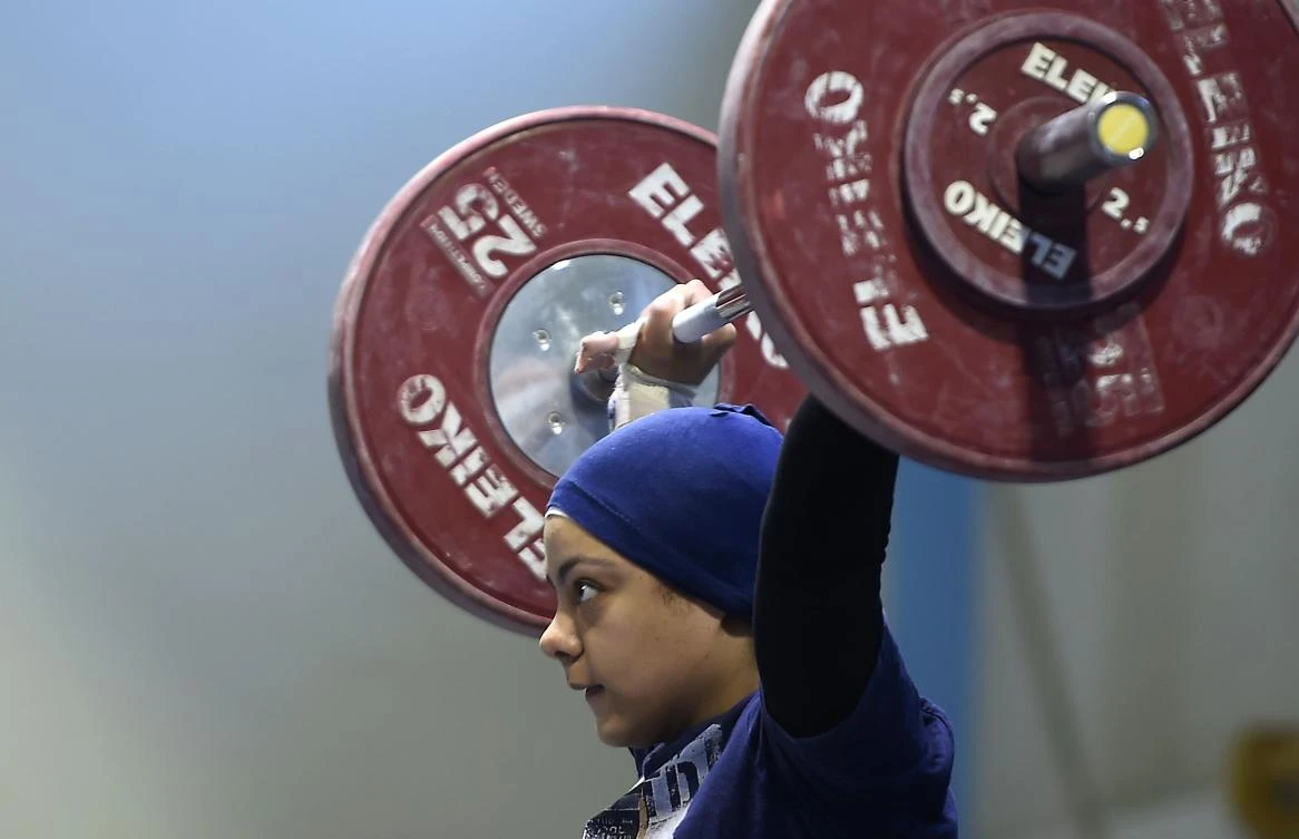 The exploits of Sara Samir, known in competitions as Sara Ahmed, 20, has boosted female participation in Egyptian weightlifting championships. (AFP)