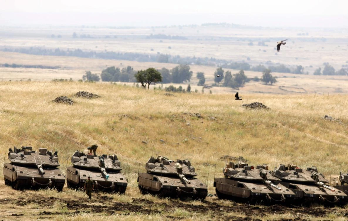 Israeli Merkava tanks are seen in a deployment area near the Syrian border in the Israel-annexed Golan Heights on May 10, 2018. (AFP)